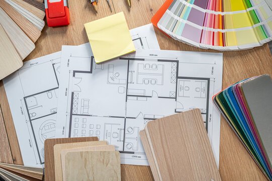 Architectural Blueprint with Color Swatches and Wood Material Samples for Interior Design Project