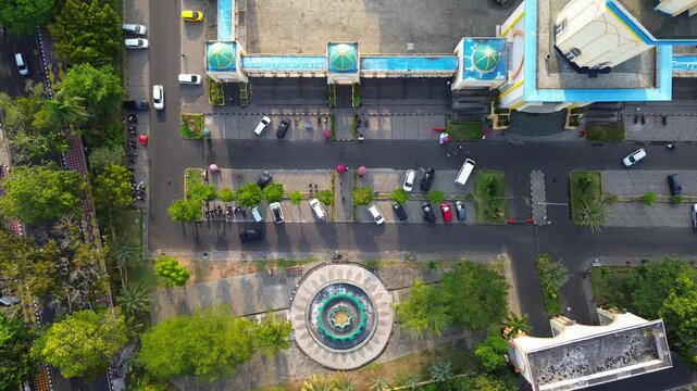 Aerial view of the Islamic Center NTB with its distinctive mosque architecture, central fountain, and surrounding parking area in Mataram, West Nusa Tenggara, Indonesia.