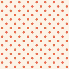 Coral polka dot pattern on beige background © BilCreate