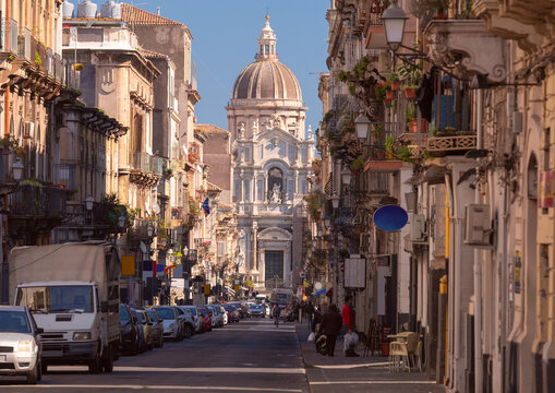 Historic Street with Cathedral Dome in Catania, Sicily, Italy