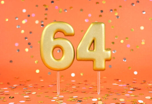 Golden Number Sixty Four Cake Topper With Confetti Background