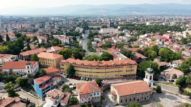 Aerial view of the historic Old Town in Plovdiv featuring terracotta rooftops, the Church of St. Constantine and Helena, and lush greenery in Plovdiv, Plovdiv Province, Bulgaria.