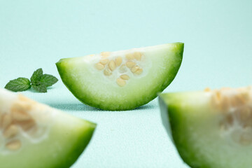 Green melon slices with mint leaves © HoangNgoc
