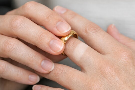 A person wearing a wedding ring, representing commitment and love