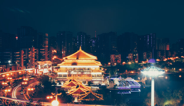 Night view of illuminated traditional Chinese architecture in Qujiang, Xi'an