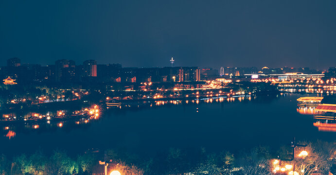 Qujiang Pool Night View with City Lights in Xi'an China