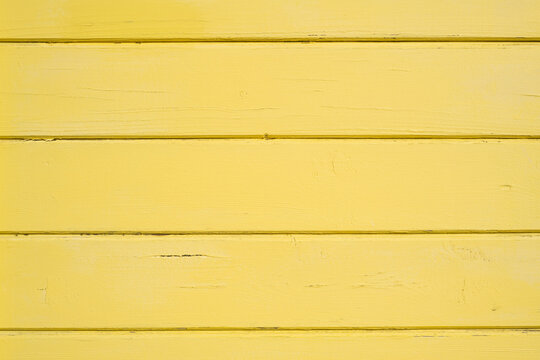 Bright yellow painted horizontal wooden boards texture