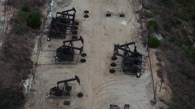 Aerial view of oil pump jacks operating in the Baldwin Hills oil field in Los Angeles, California, United States.