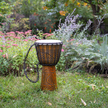 traditional African djembe hand drum in a backyard