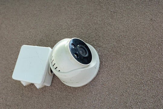 Security camera equipment lying on a surface without any signs of being used or mounted right now