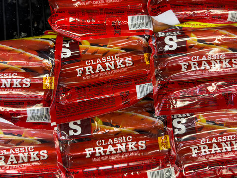 Frisco, Texas, USA - September 14th, 2026: Bar S Classic Franks hot dogs red packages stacked on retail shelf in supermarket store display