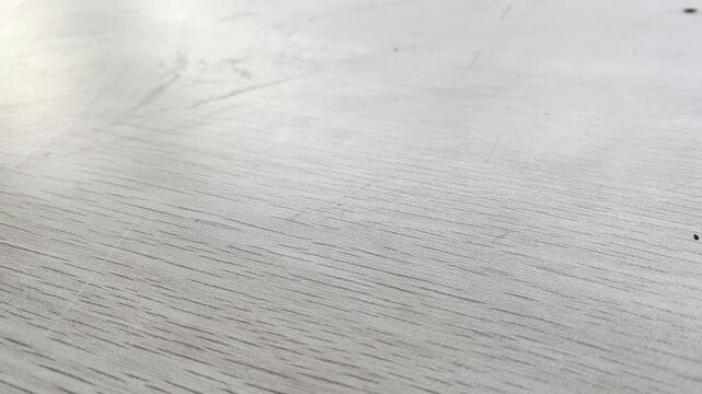 Natural wooden table surface texture with subtle grain patterns