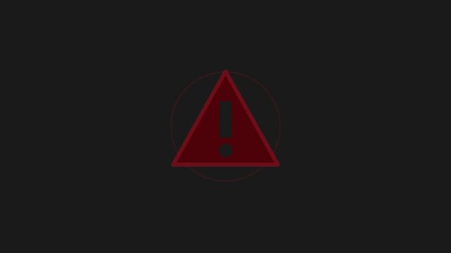 Warning sign triangle flashing red motion video footage representing danger and caution on dark background