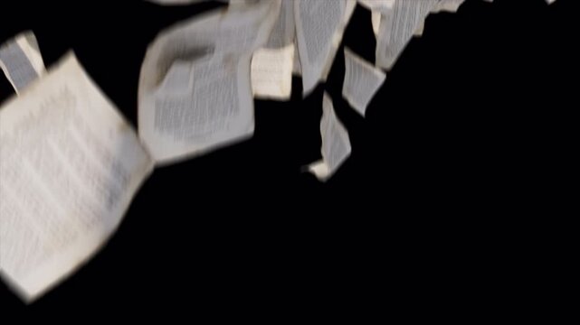 Many sheets of white paper flying and falling in the air against a black background.