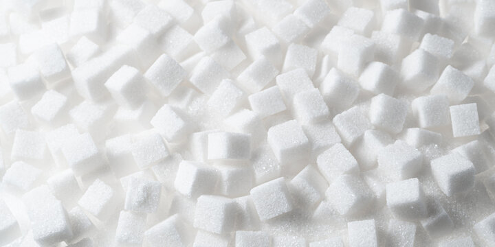 White refined sugar cubes background texture