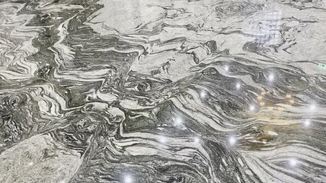 Luxury Copacabana granite slab texture with polished surface and light reflections