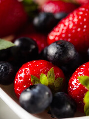 Fresh strawberries and blueberries © Yuliia Kosmeniuk