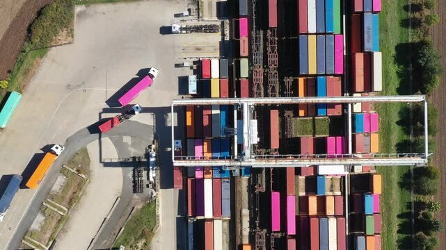 Aerial view of containers at railway. Big container terminal on a railroad with open storage area.