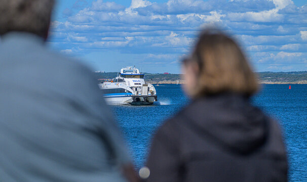 Gothenburg, Sweden - August 11 2026: Val&ouml; ferry crossing Swedish archipelago viewed between waiting passengers.