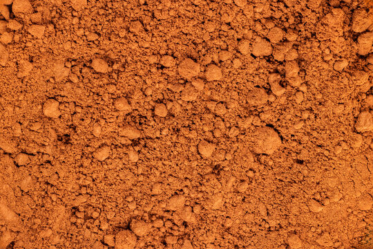 Brown cocoa powder creating a rich background texture