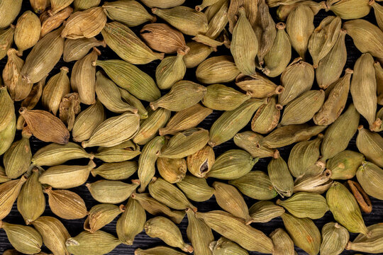 Green cardamom pods displaying natural texture and aroma