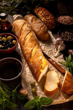 Freshly baked baguettes and rustic mediterranean ingredients