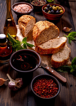 Fresh baked bread with olive oil, balsamic vinegar and spices