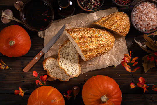 Freshly baked bread with pumpkins and autumn spices