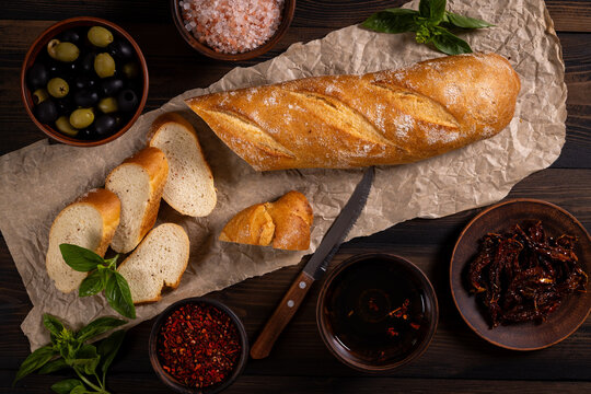 Baguette slices with olives, sundried tomatoes, and spices