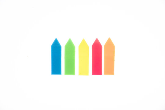 Vibrant plastic bookmark flags positioned side by side against isolated white backdrop providing practical sticky tags for reminder organizing and planning