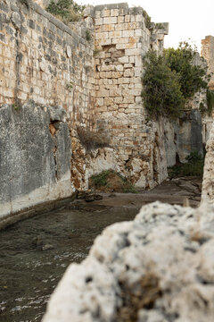 Sea-filled defensive moat in front of Korykos land castle on the Mediterranean coast in Kizkalesi, Erdemli, Mersin Province, Turkey.