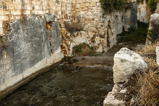 Sea-filled defensive moat in front of Korykos land castle on the Mediterranean coast in Kizkalesi, Erdemli, Mersin Province, Turkey.