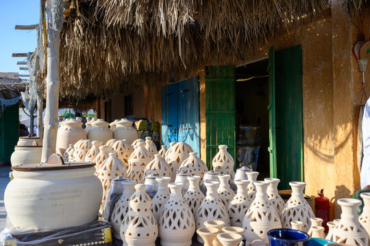 Doha, Qatar &ndash; November 29, 2023: A daytime shot from the Katara Traditional Dhow Festival showing a popular market displaying a variety of traditional pottery, decorative geometrically perforated clay
