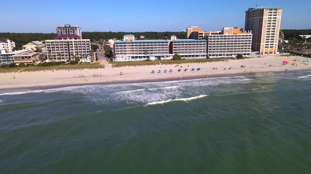 beachfront resort grows larger as the drone approaches Myrtle Beach from offshore.

