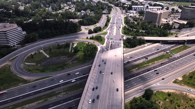4K drone video reveals a highway interchange and suburban panorama in Tysons, Virginia.
