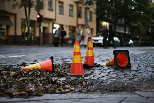 Orange Cones On Cobblestone Street