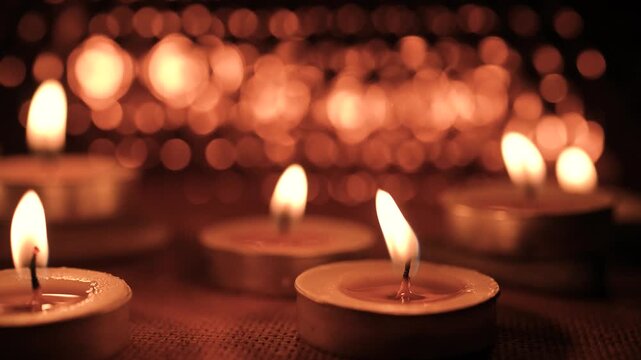Burning Candles in Warm Bokeh Light for All Saints Day Remembrance, bokeh effect. All Hallows' Day. Solemnity of All Saints. 