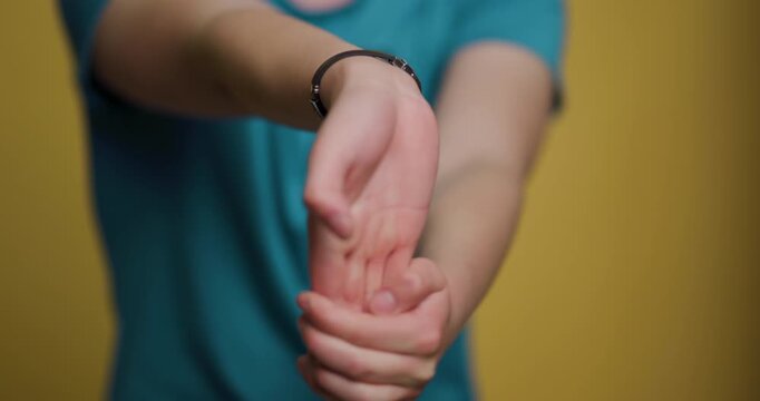 Man performs wrist stretching exercises for improved flexibility and health benefits