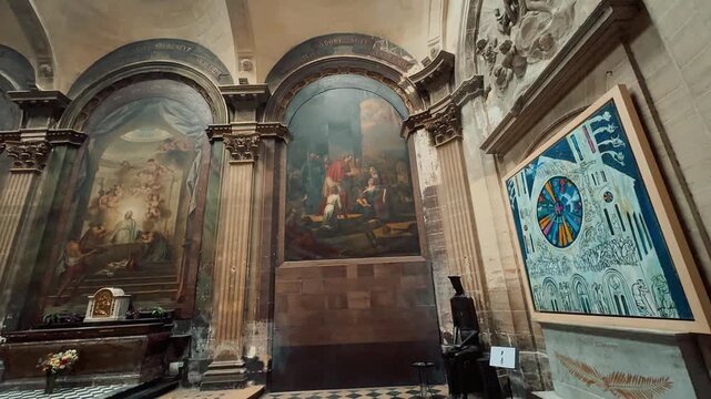 Explore the majestic interior of a historic French church, showcasing soaring Gothic ribbed vaults, colorful stained glass windows, serene altar with crucifix, and classical paintings in side chapels.