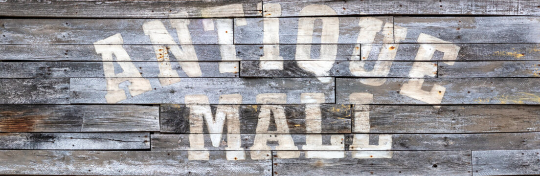 Antique Mall painted on rustic sign made of old barn wood planks