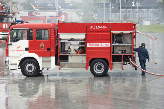  Fire fighters are checking and preparing their fire equipment into the fire truck after operating. Saint Petersburg, Russia, September 6, 2026
