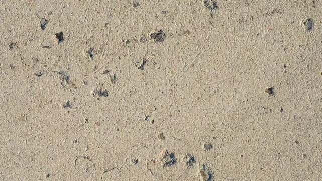 Abstract grunge sand plaster wall texture background loop in 4k ultra hd