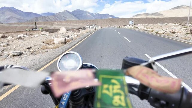 first person view of a motorbike riding on the roads of Ladakh in the Indian Himalaya