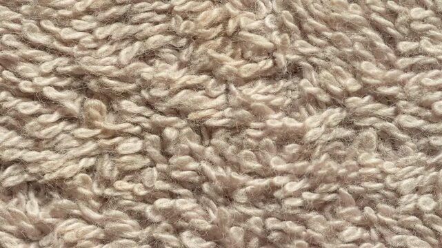 Abstract soft brown carpet texture background loop in 4k resolution