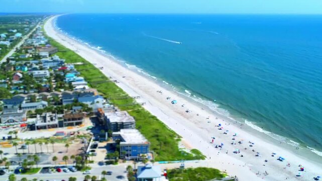 Tilt-shift Vilano Beach 2026 construction beach goers and boats