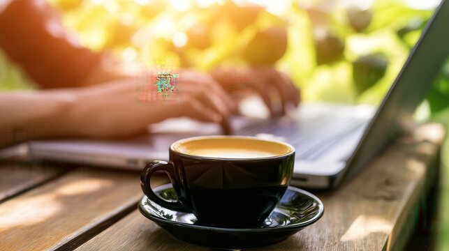 Person working remotely with coffee in bright outdoor workspace featuring copy space