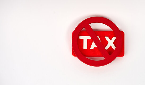 Tax sign covered by prohibition symbol representing tax exemption isolated on white background
