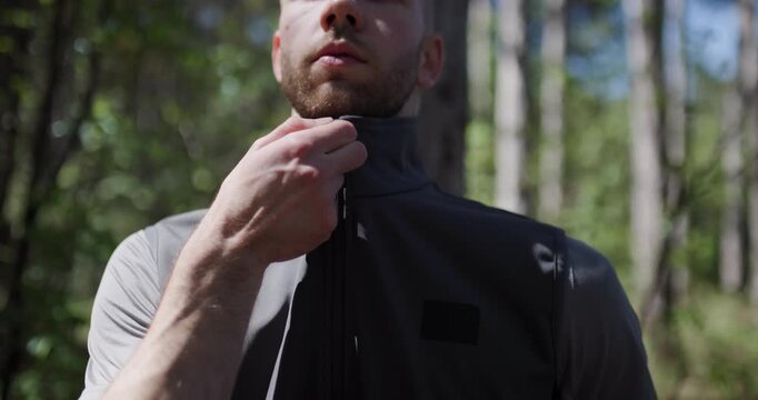 Outdoor adventure tips while wearing a practical zippered vest in a lush forest environment on a sunny day