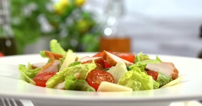 Caesar salad closeup on white kitchen background