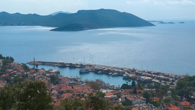 Scenic view of kas harbor and mediterranean sea in turkey. Beautiful aerial view of the charming coastal town of kas in turkey, featuring its picturesque harbor with boats and yachts and the sea